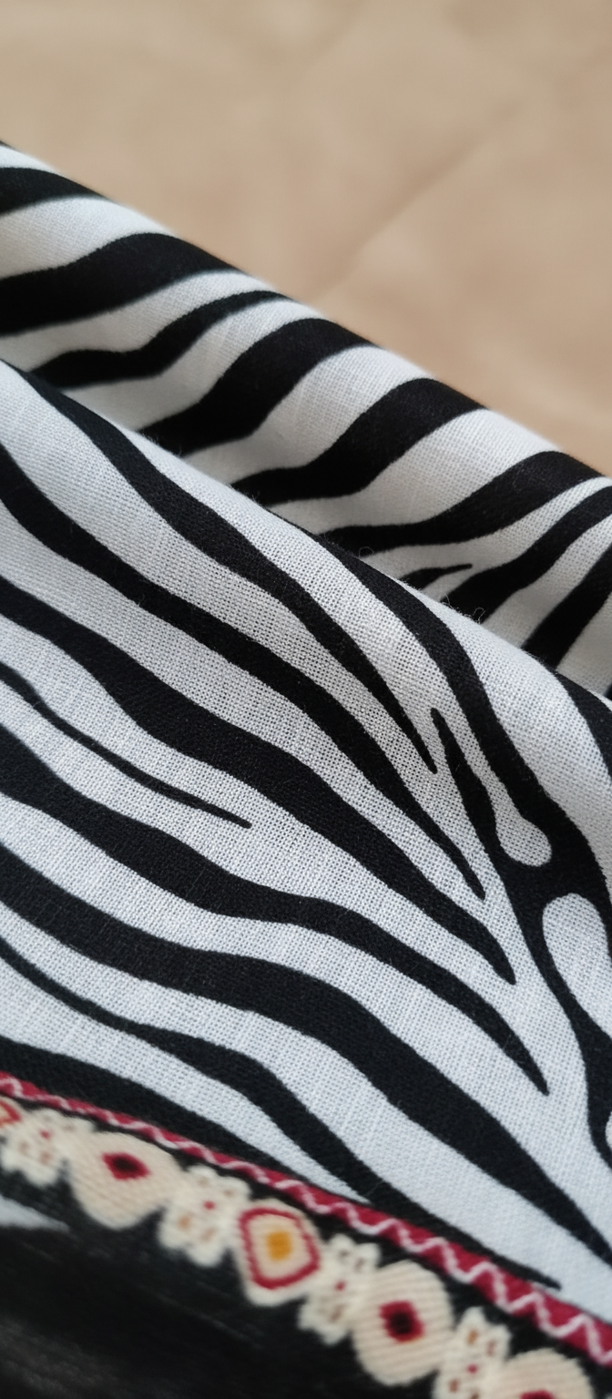 Close-up texture detail of zebra print kanga leso