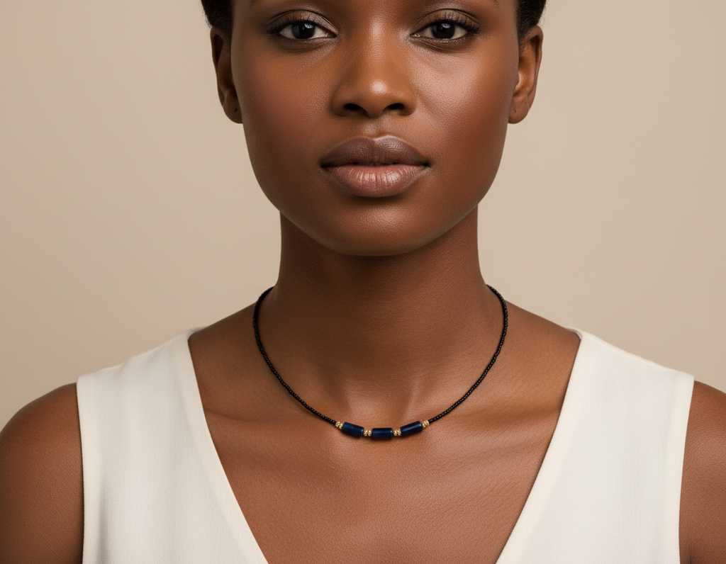 Model wearing black and navy necklace