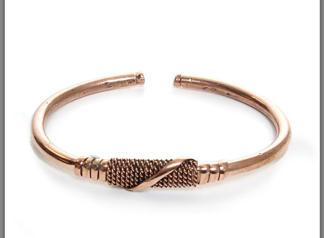 Handcrafted African copper bracelet with adjustable bangle design"
